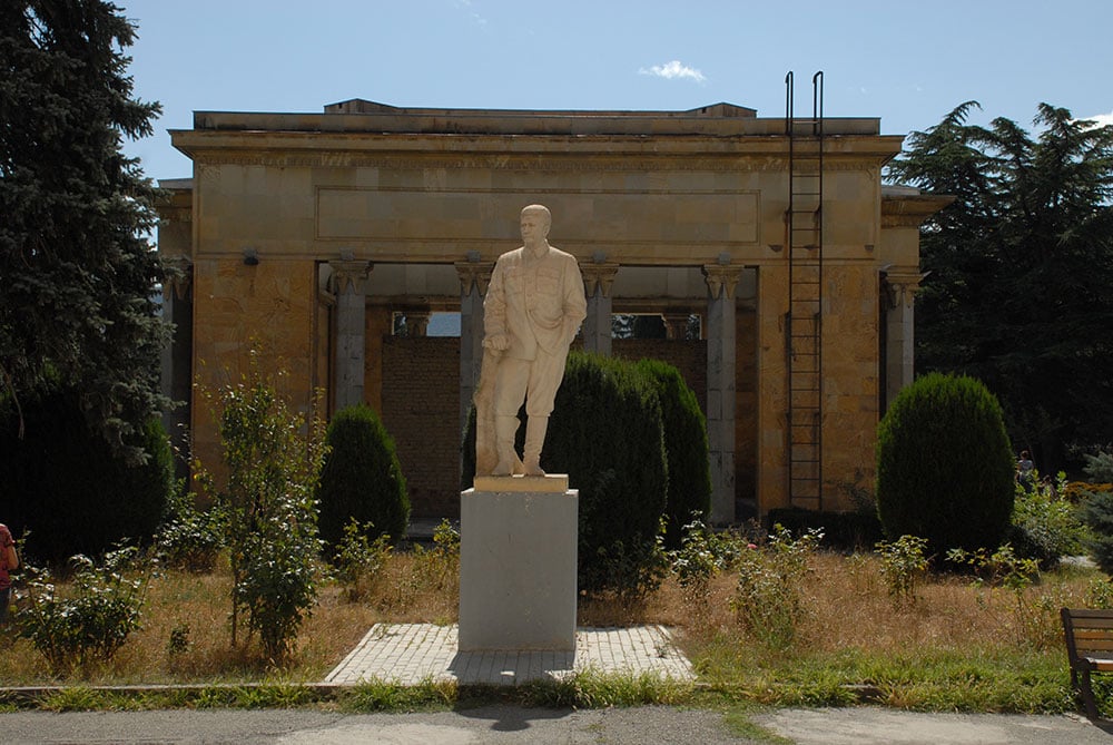 A statue of Stalin stands behind the house he was born in. Image: Guram Tsibakhashvili