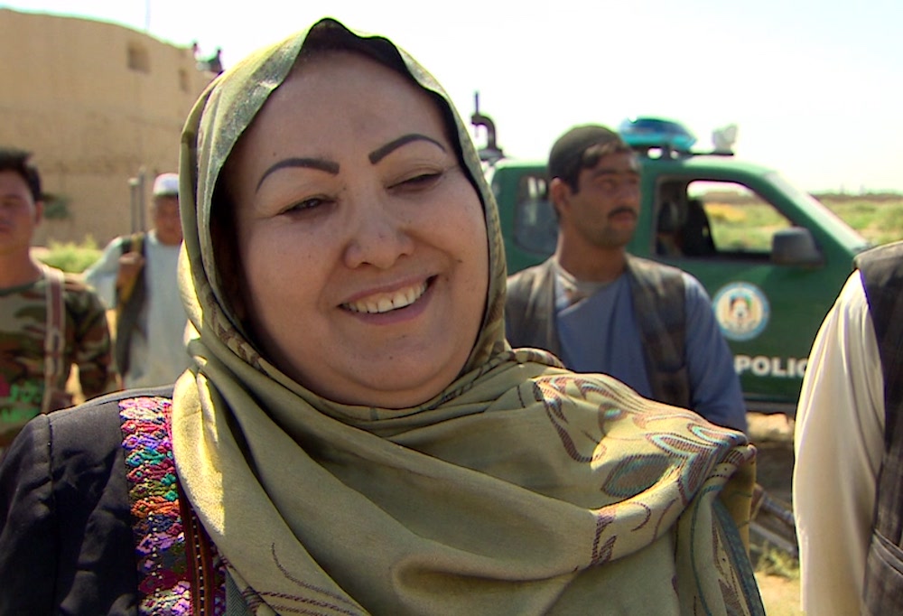 Screenshot of a news report featuring Soyra Saddot, Afghanistan's first female district governor
