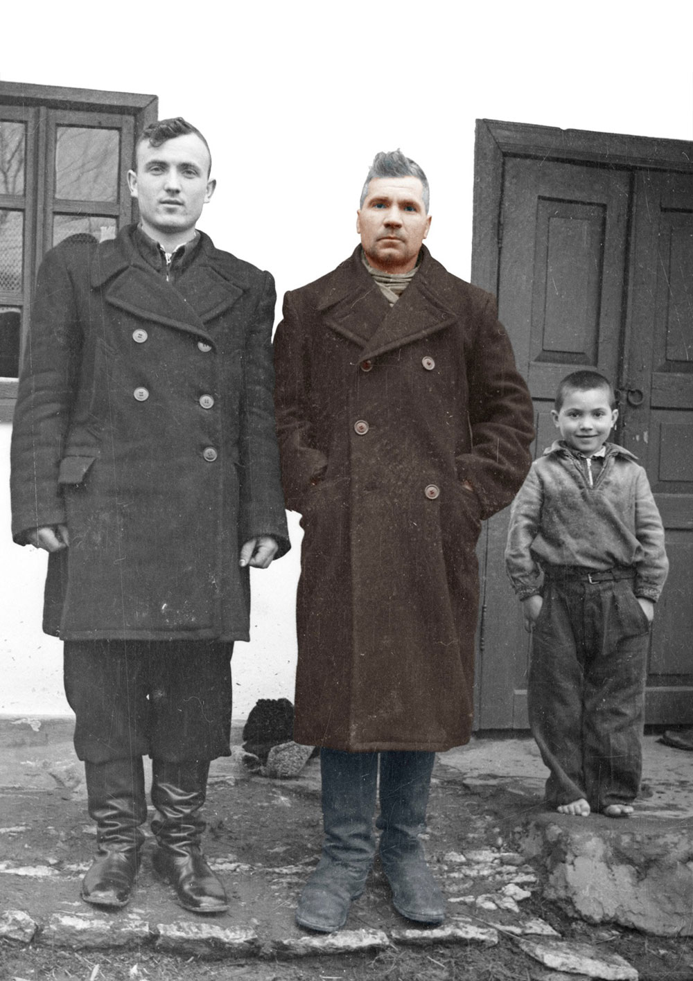 Zaharia Cușnir is pictured in the middle, next to his son and son-in-law in 1956. Image coloured by Lică Sainciuc
