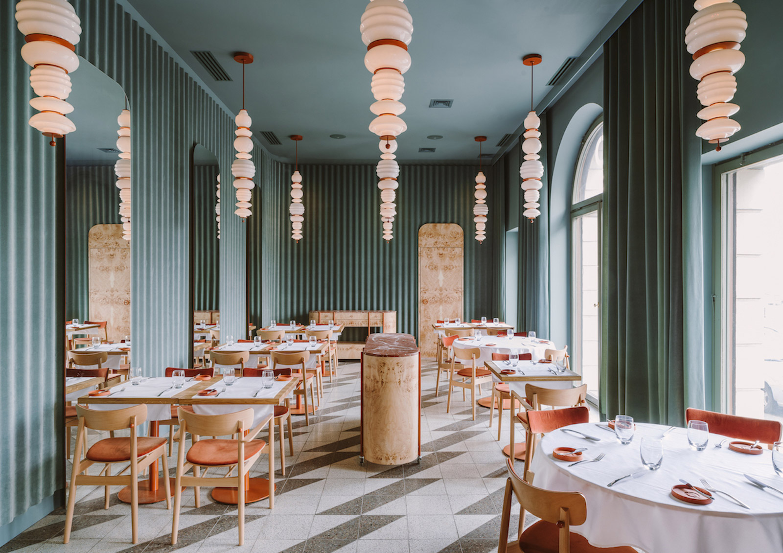 This cosy coral and sage-hued restaurant in Warsaw is already scooping up major design world prestige