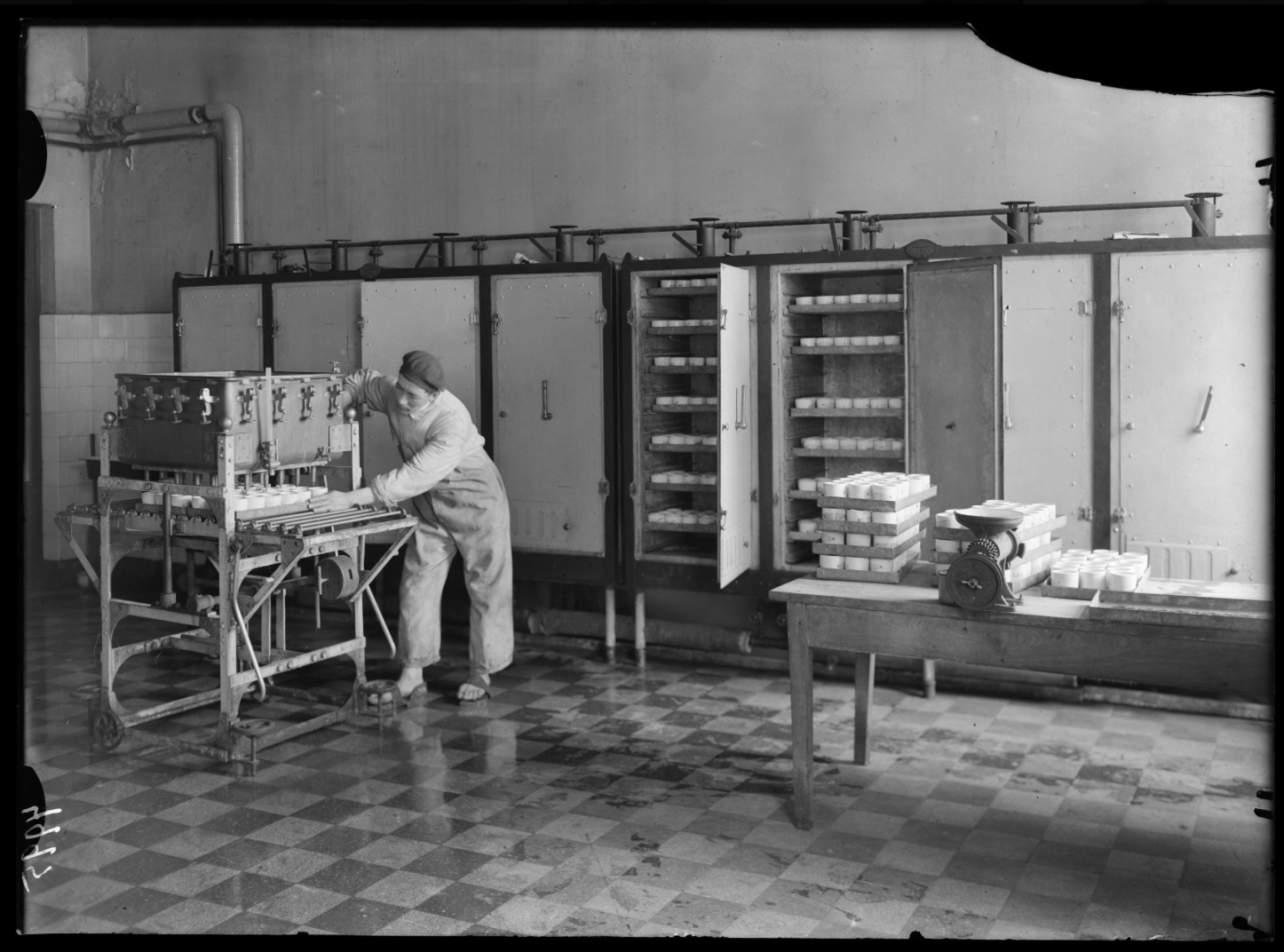 Worker in milk factory, 1920-40
