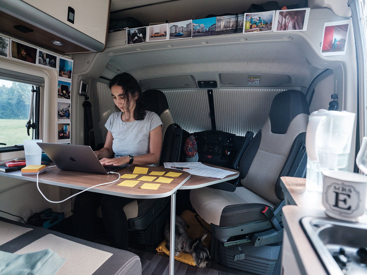 Elena Stancu working in the campervan