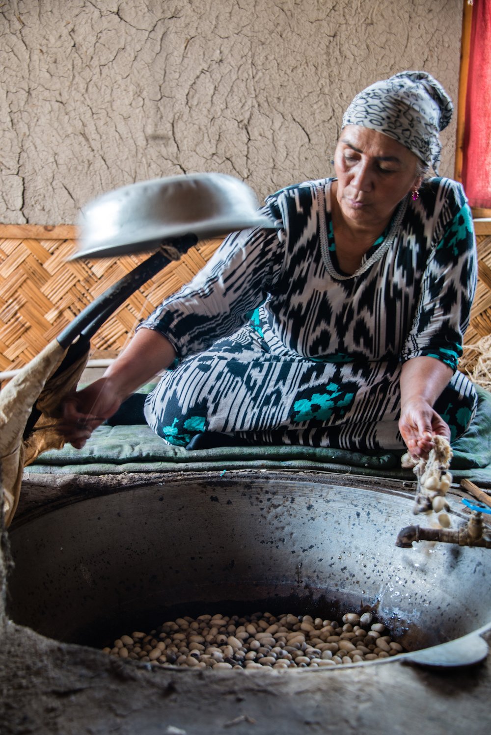 Woman boiling silk cocoons. Image: 2008+ under a CC licence