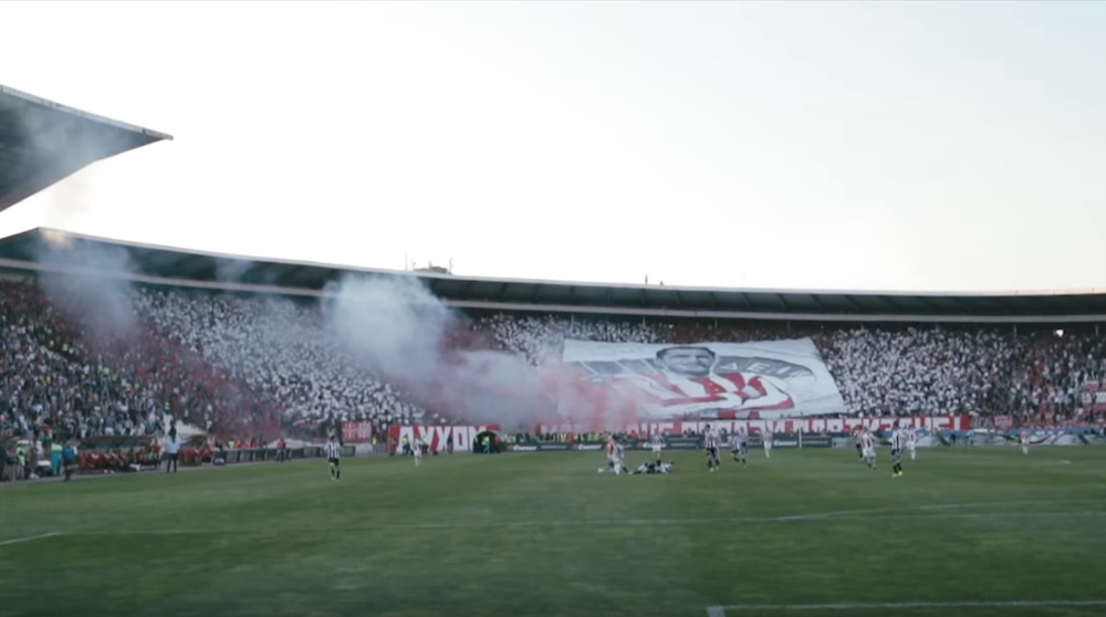 Red Star fans unveil a giant banner during the game. Image: COPA90/Youtube