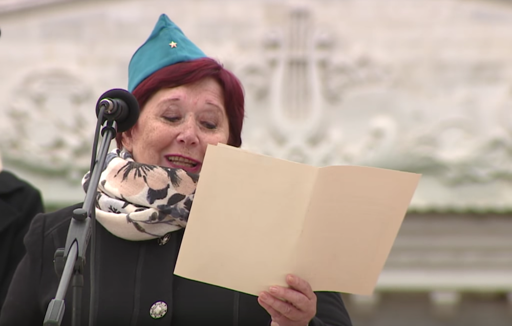 A former Komsomol member reads the letter retrieved from the Tiraspol capsule in a public ceremony. Image: TCB/Youtube