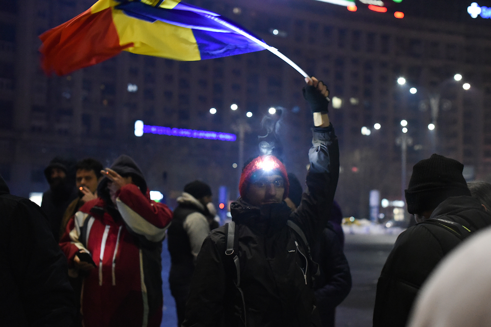 A protester prepares to contribute to the 