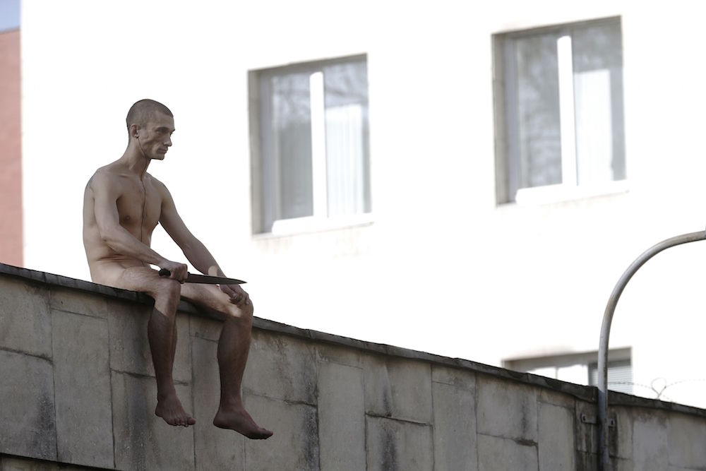 Petr Pavlensky during his 2014 performance piece 'Separation' (Missoksana under a CC licence)
