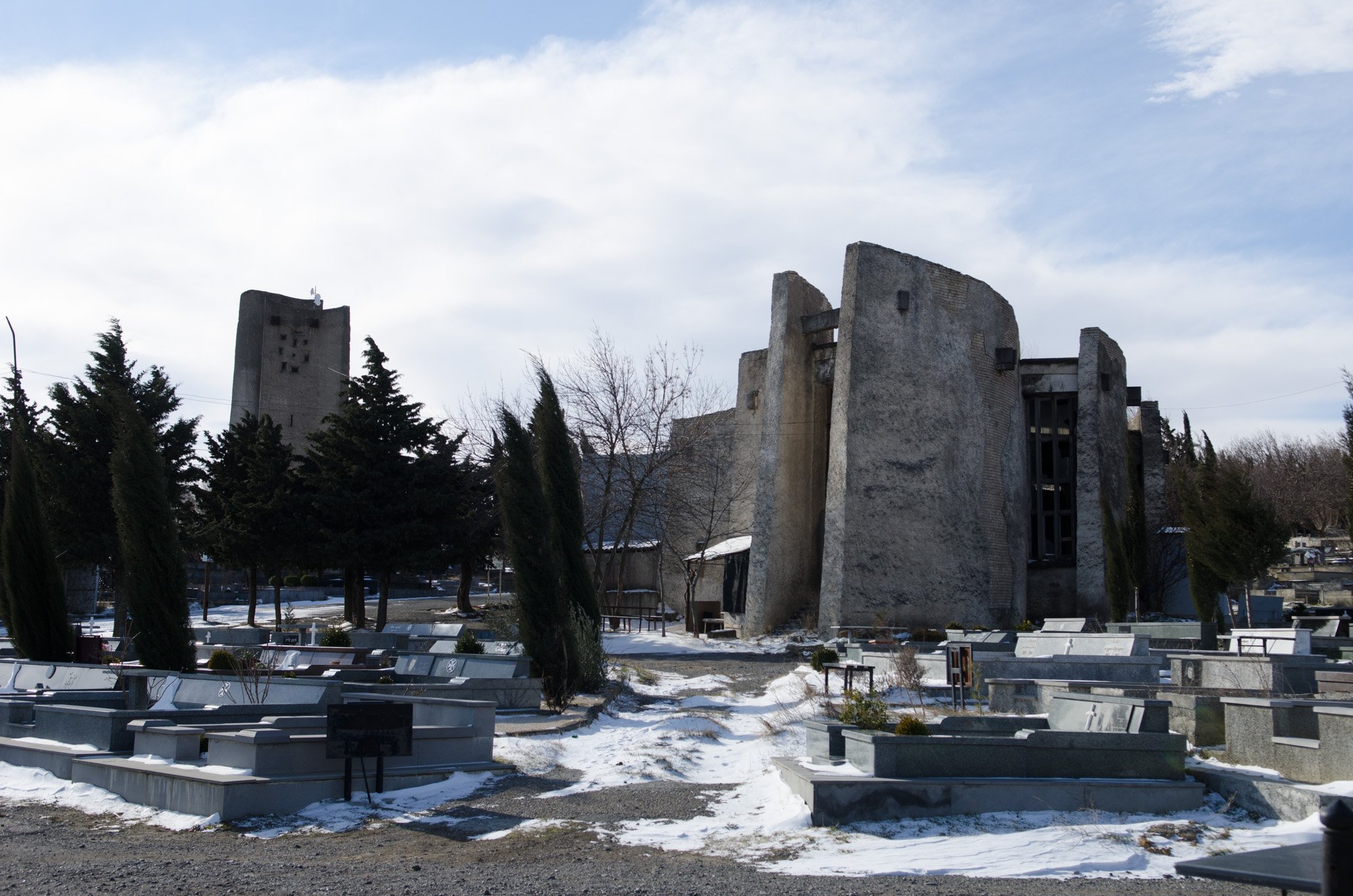 The cemetery office at Mukhatgverdi. Medieval Georgian gravestones adorn the facade. Image: Vladimer Shioshvili