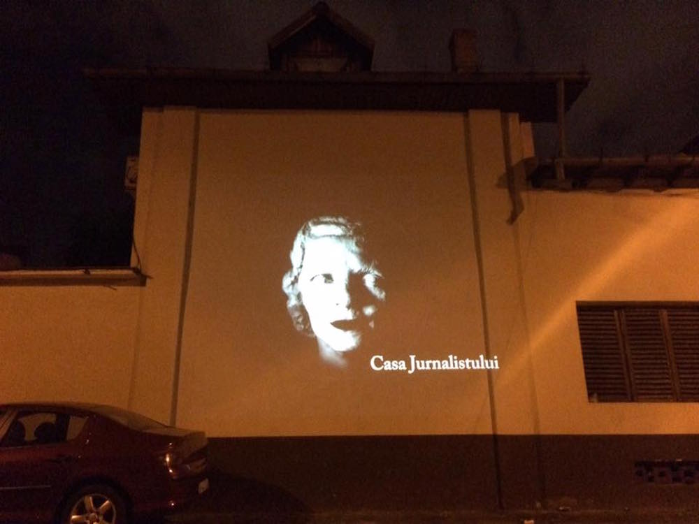 Projection of the Casa Jurnulistului logo during an open-air screening in Bucharest. Image: Casa Jurnulistului/Facebook