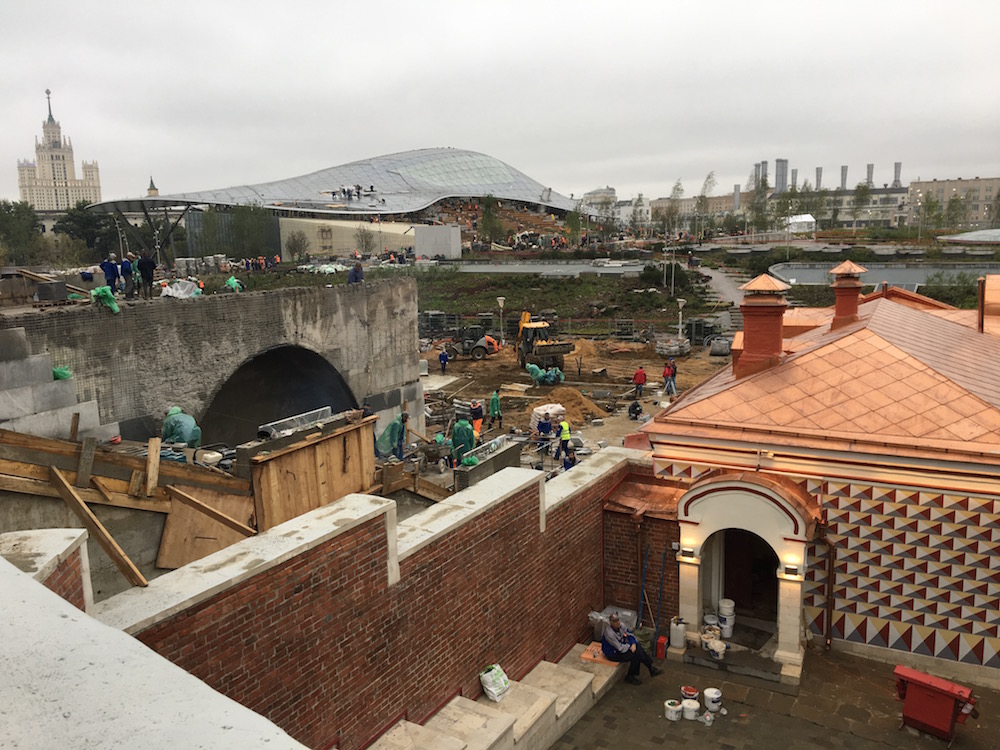 Labourers rush to ready the park a few days ahead of its opening. Image: Michał Murawski