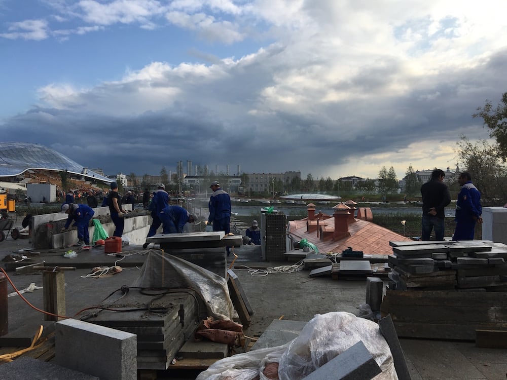 Labourers rush to ready the park a few days ahead of its opening. Image: Michał Murawski