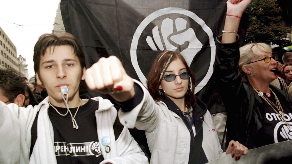 Protesters from the Otpor! movement march on Belgrade in October 2000 demanding the removal of Slobodan Milošević.