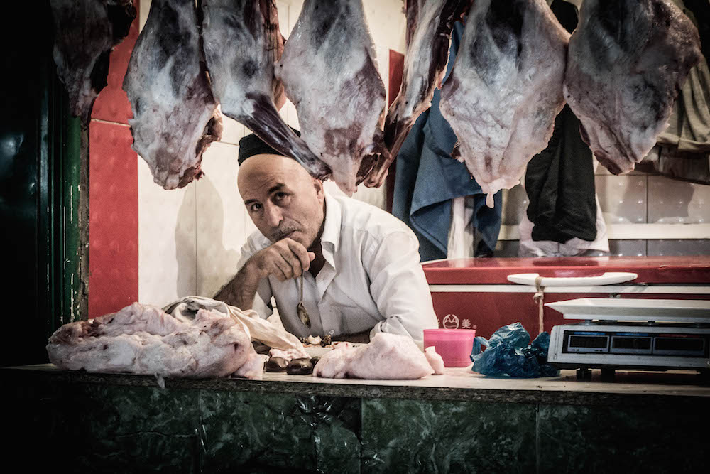 A butcher in Dushanbe’s central market. Image: Ronan Shenhav under a CC licence