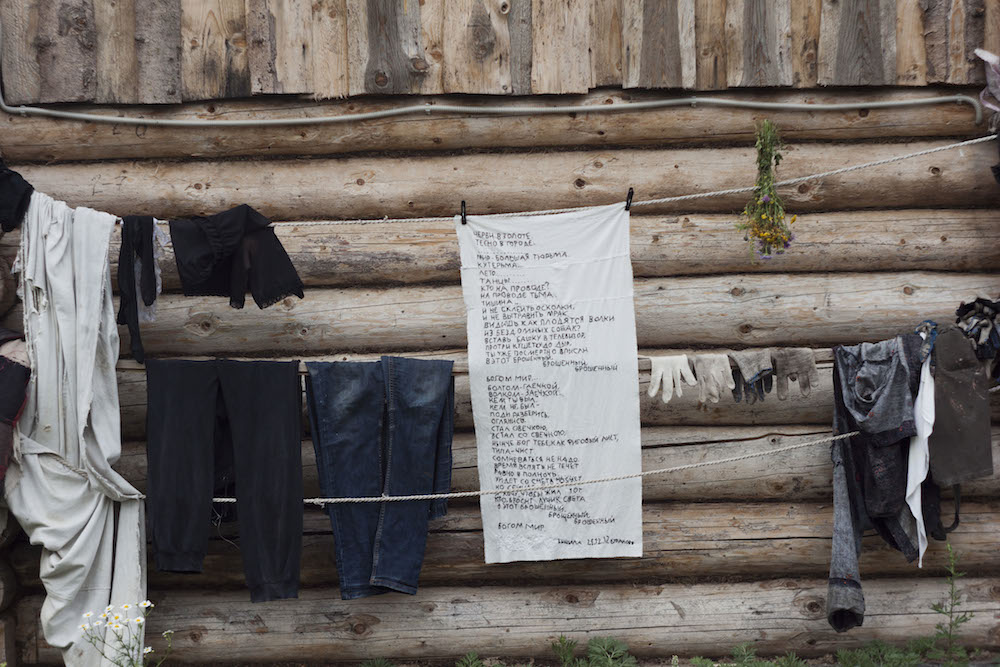 The washing drying in the village. Lebedeva embroidered Boris Grebenshikov's poem on a towel