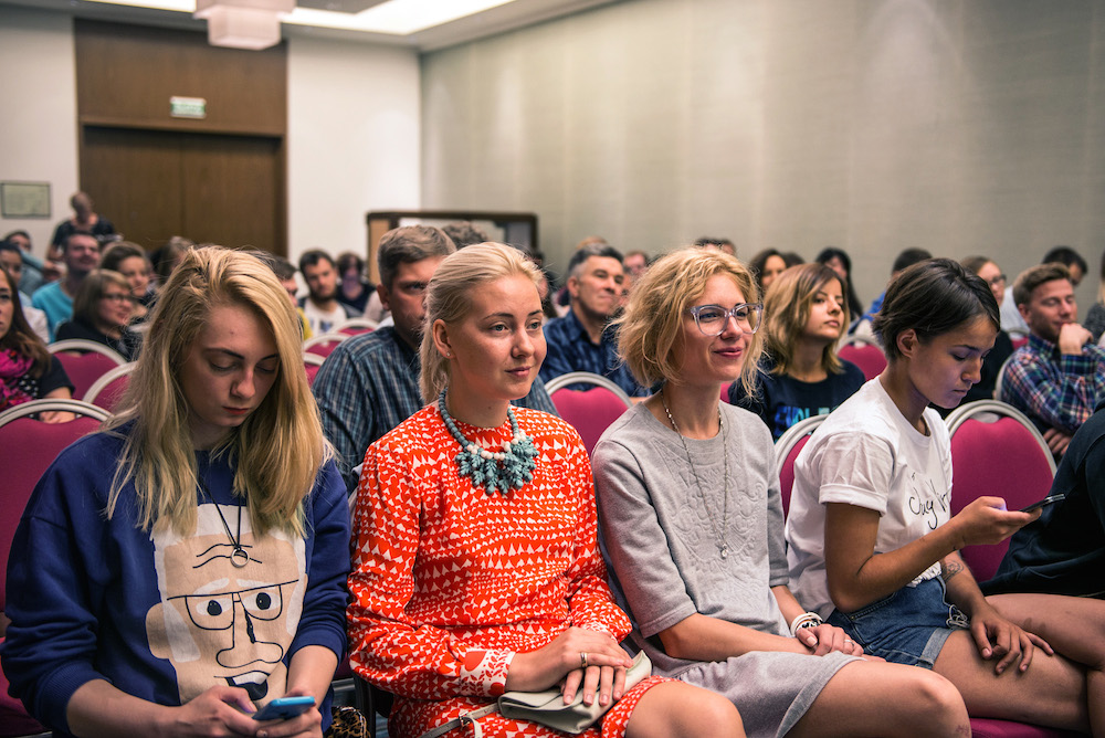 Participants listen to speeches at the street food conference