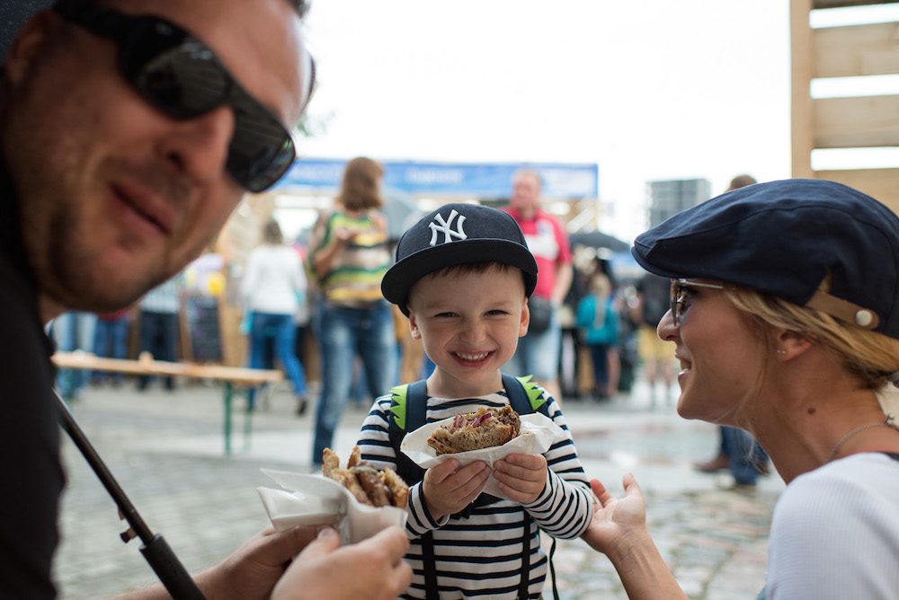 A young Kaliningrader tucks into a burger. Photographs: Vova Chernyakhovskiy