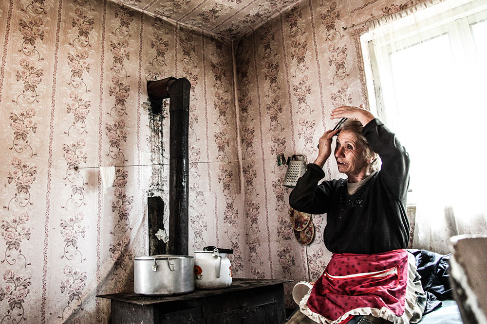 Local woman in her home (Zgubir, South Ossetia)