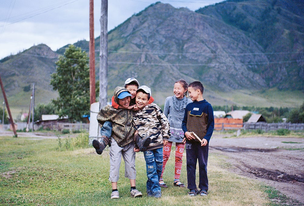 These bashful Altai children learn Russian in school. Their teacher is Altai