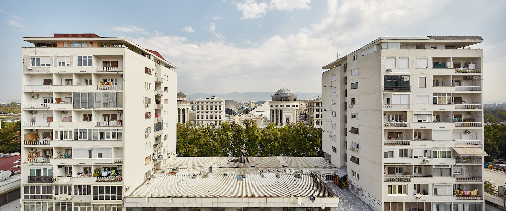 View on central Skopje through two socialist-era housing blocks. Image: Vase Amanito/amanito.mk