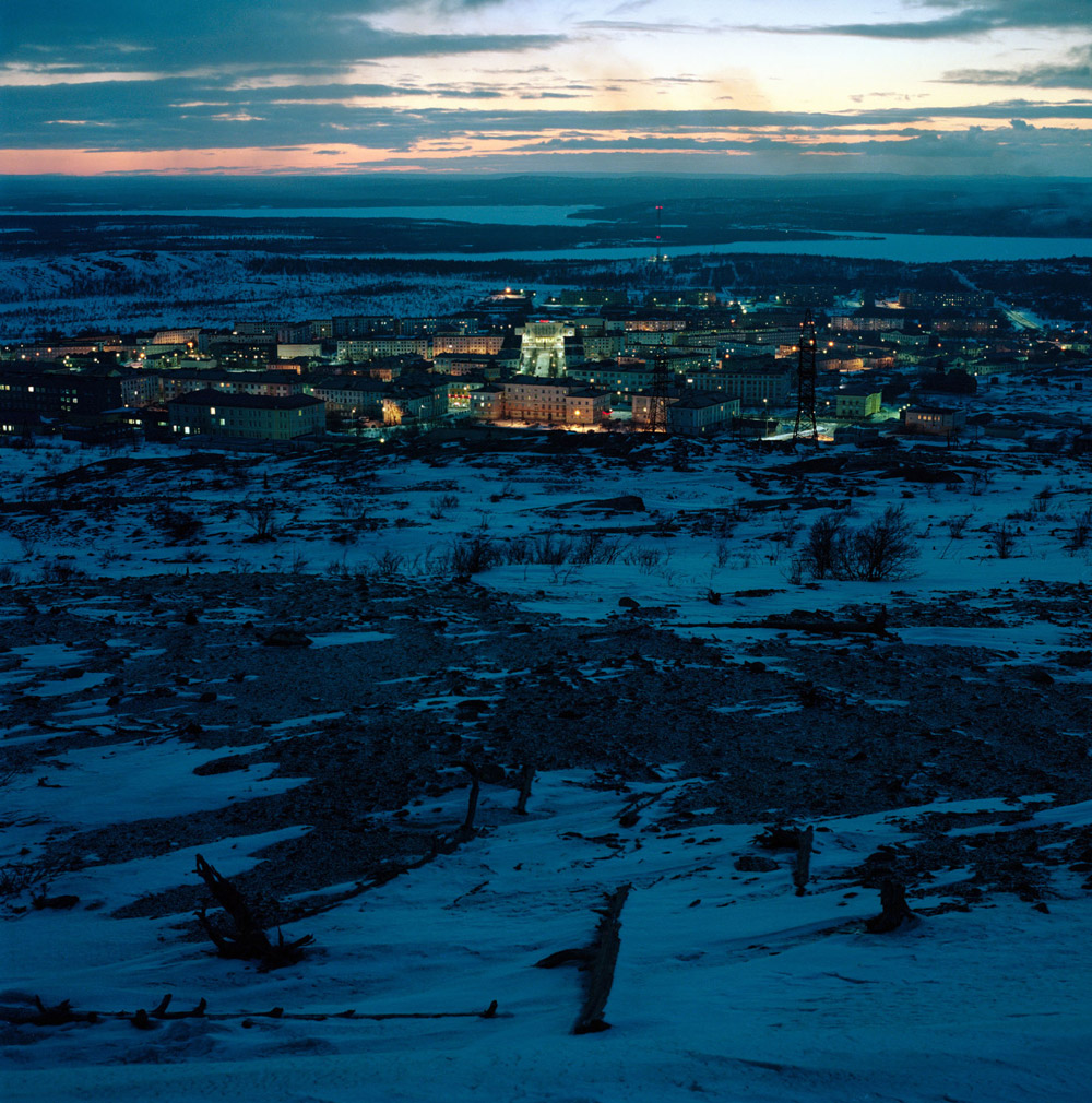 Nikel at night. Sulfur emissions from the nickel processing plant have destroyed nature around the city