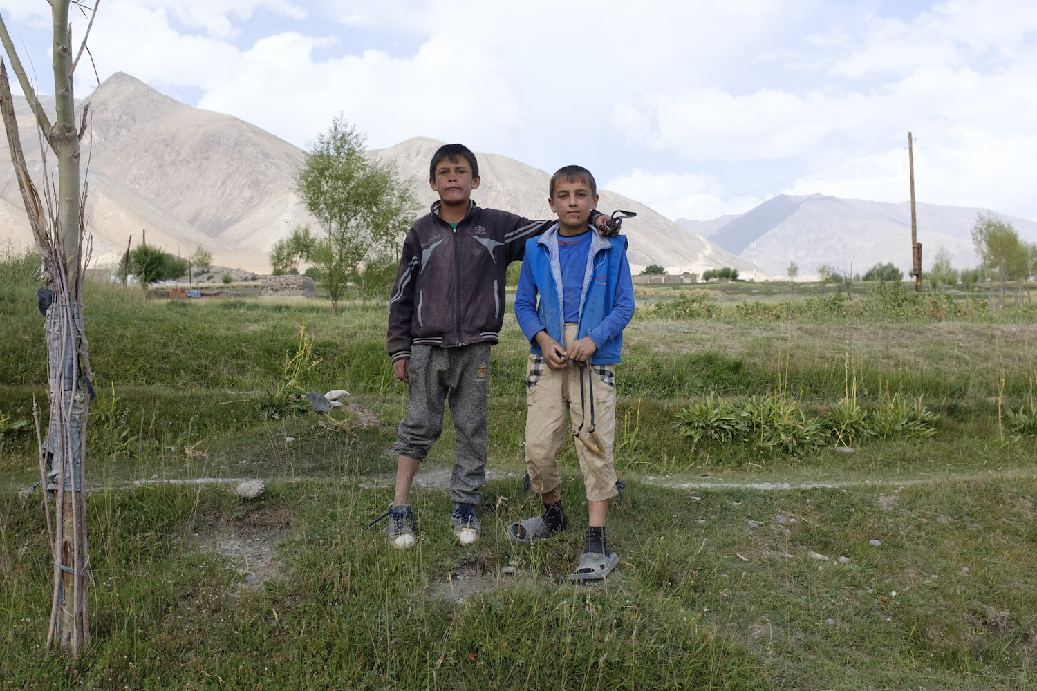 Children pose for their portrait in the village of Roshorv