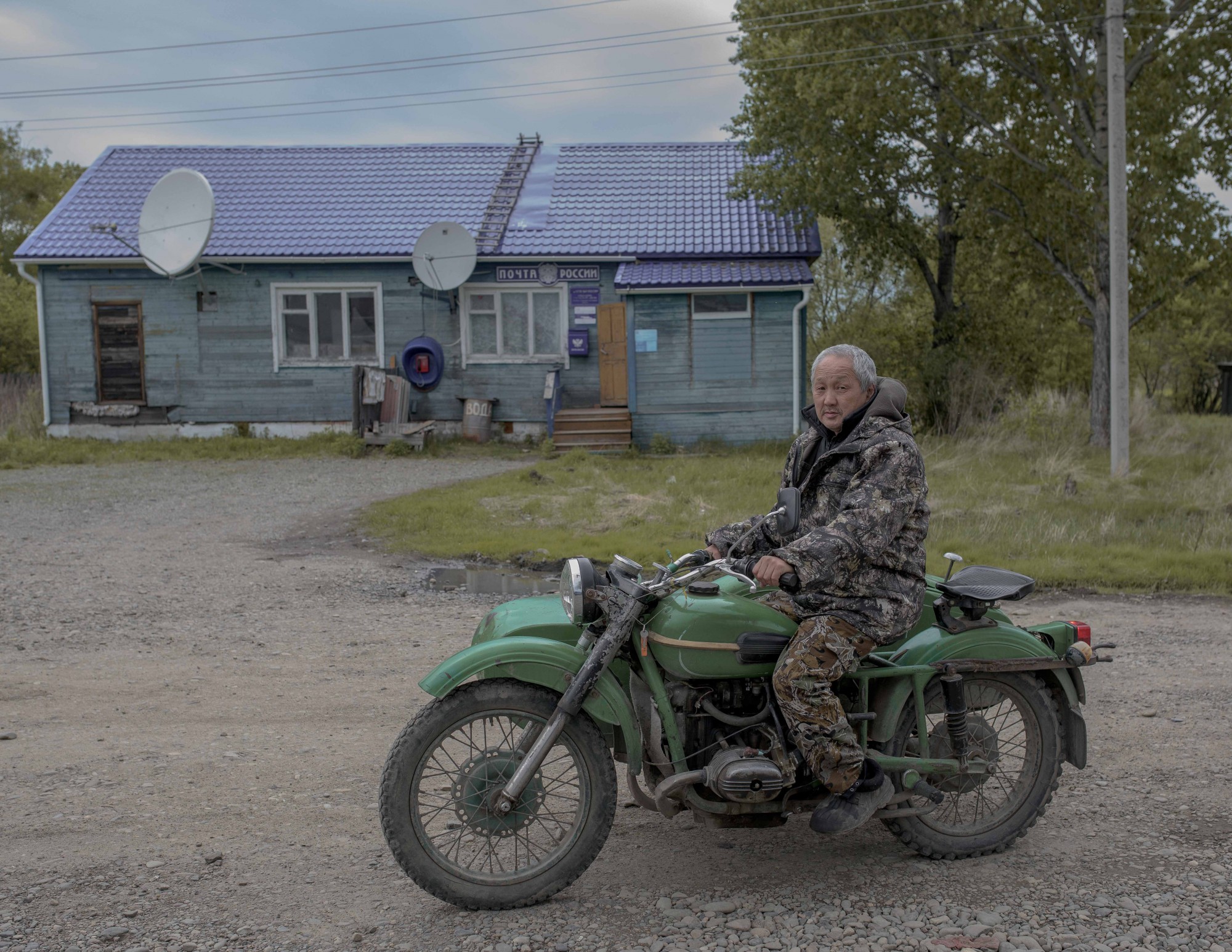 A resident of Naikhin pictured outside the Post Office