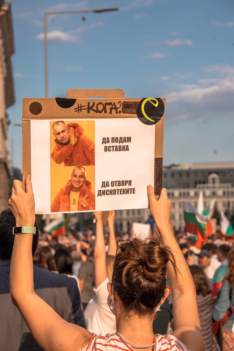 A poster superimposing the head of Bulgarian Prime Minister Boyko Borissov over an image of popstar Drake. The top text reads, "Resigning", the bottom reads, "Reopening nightclubs [amid the Covid-19 pandemic]" 