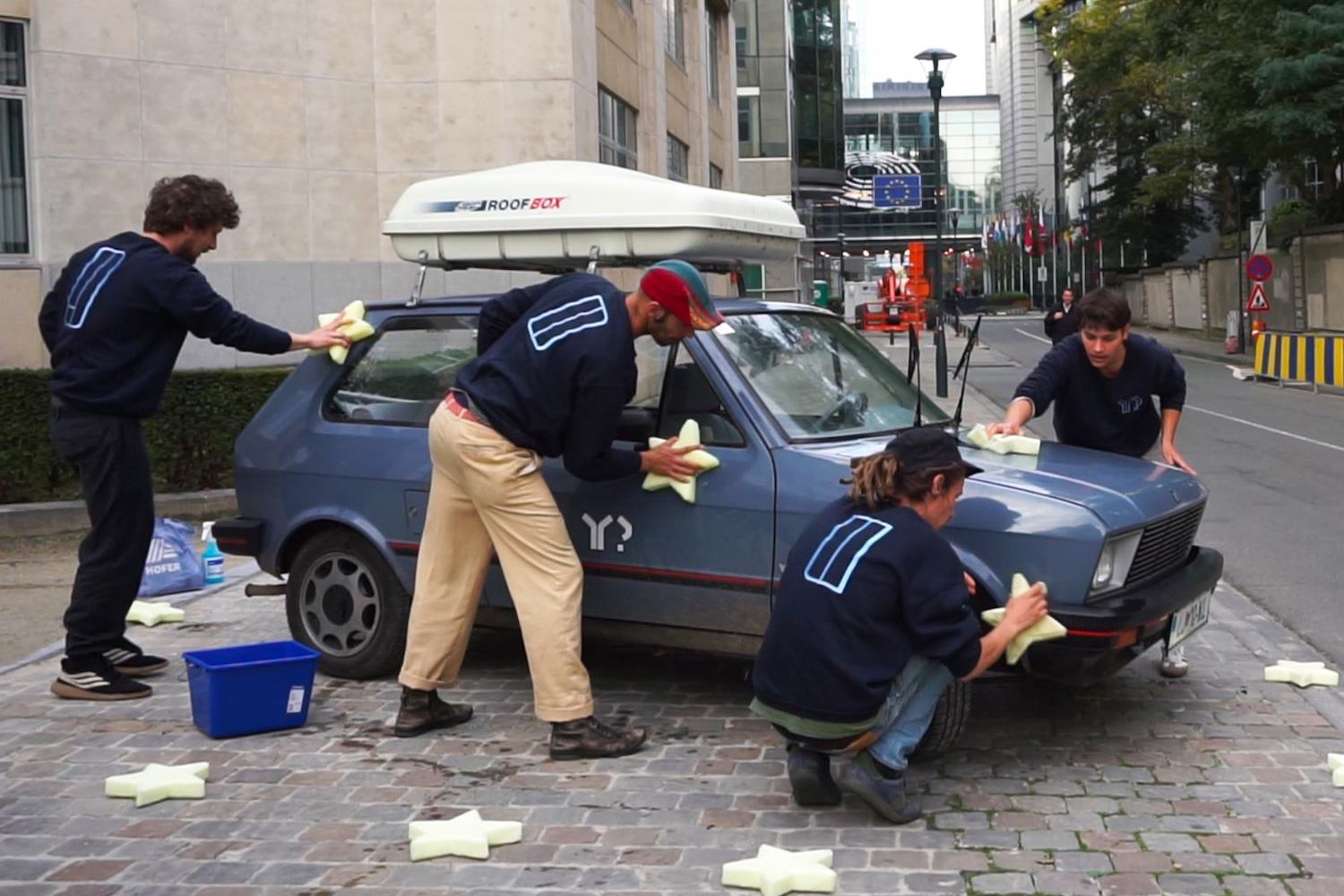 The team take part in an art intervention in Brussels.  Image: Y? Project
