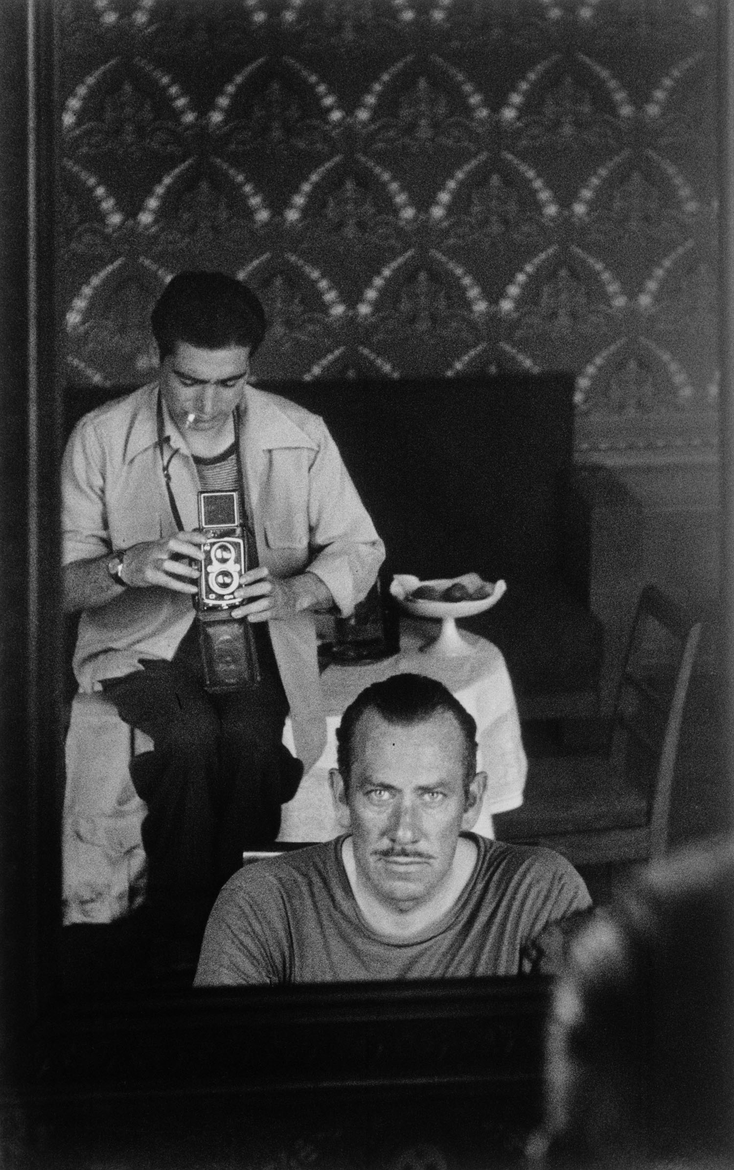 John Steinbeck and Robert Capa reflected in a mirror. USSR, September (1947). Image: International Center of Photography/ Magnum Photos 