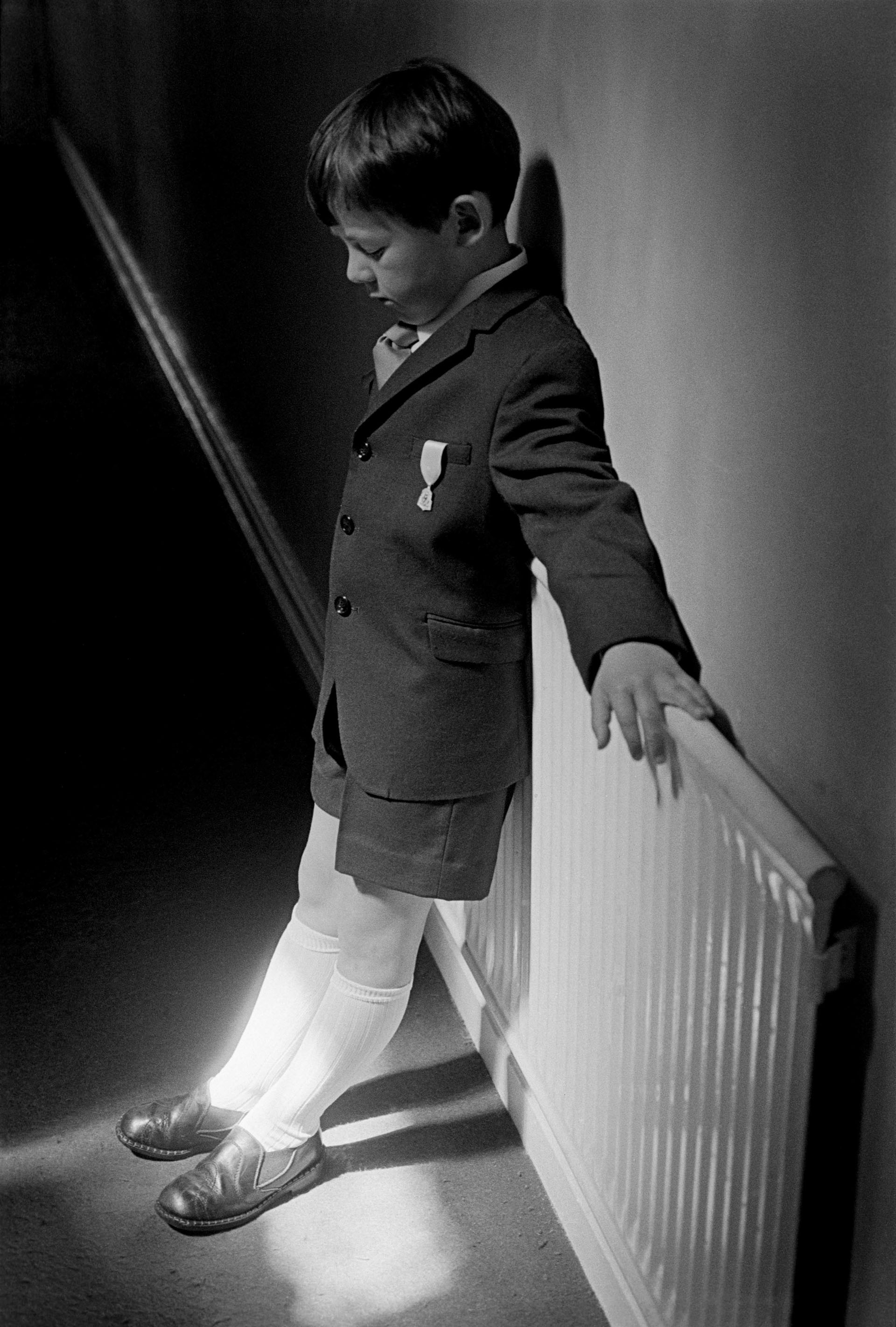 Józef waiting to go to church for after his First Holy Communion, Loughborough (1976)