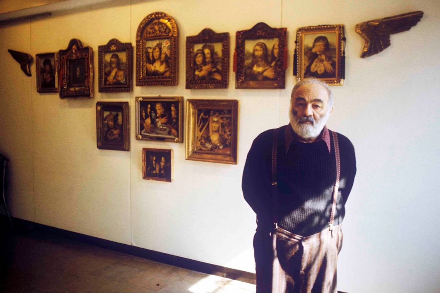 Parajanov poses near his Mona Lisa series at a 1990 exhibition in Yerevan, Armenia. Image: Zaven Sargsyan, director of the Parajanov Museum.