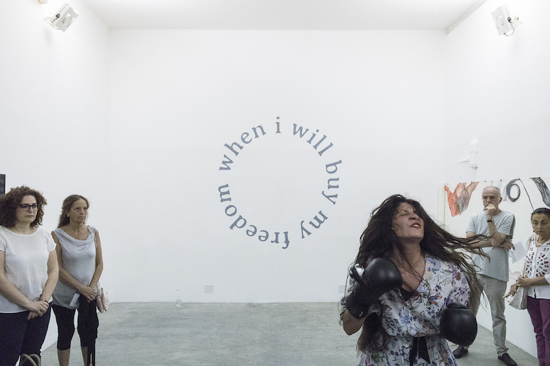 Selman performing her artwork, “Superpositional Intersectionalism” in 2017. Image courtesy of the artist