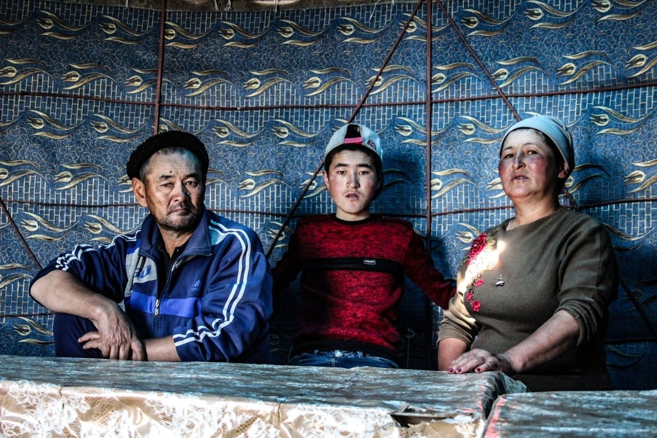 A Kyrgyz family in a yurt in Ala Bel Pass, Kyrgyzstan. 