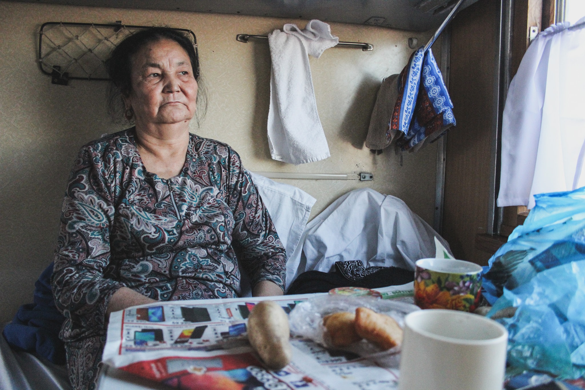 Aiday, a Kazakh woman I met on the train from Kazakhstan to Uzbekistan, who fed me chicken and manty (dumplings) sold at train stops along the way
