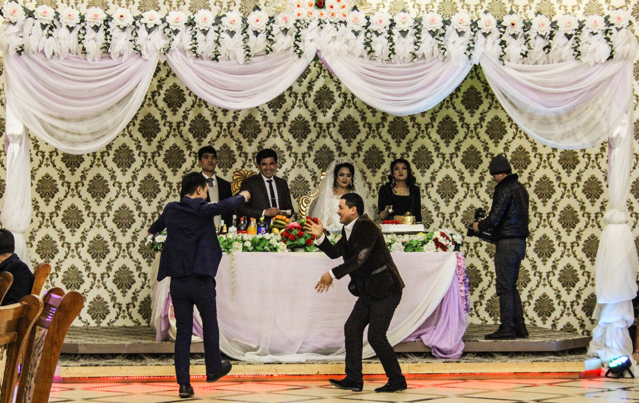 Dancing at an Uzbek wedding organised to collect money for the newlyweds