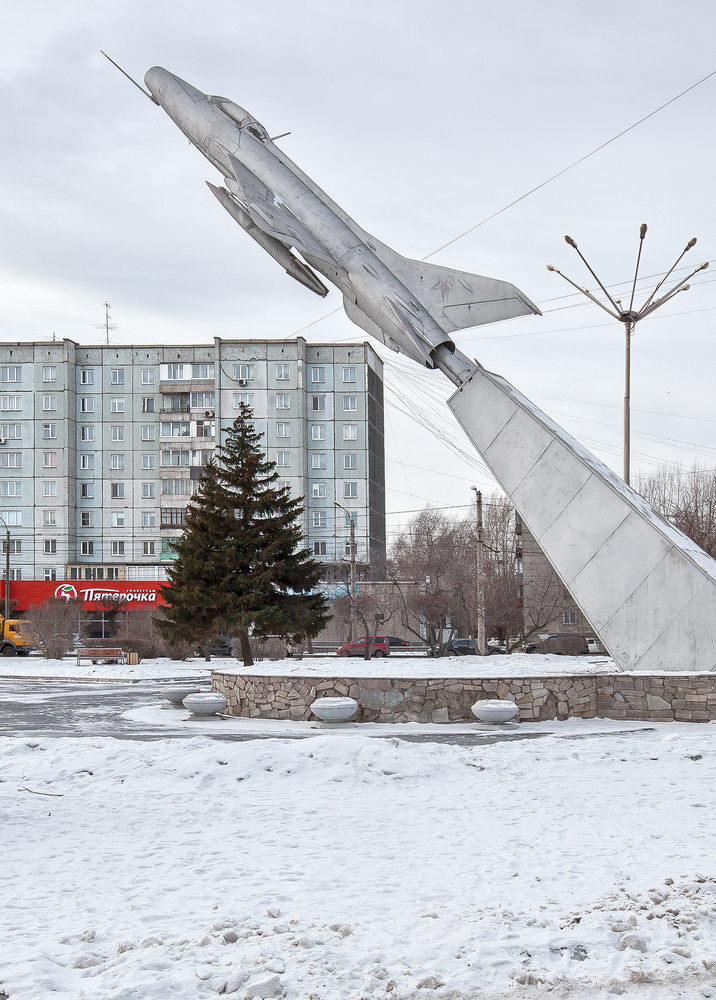 Mig-21F Plane and a 1980s Panelka (Prefab panel block), Krasnoyarsk. Image: Zupagrafika 