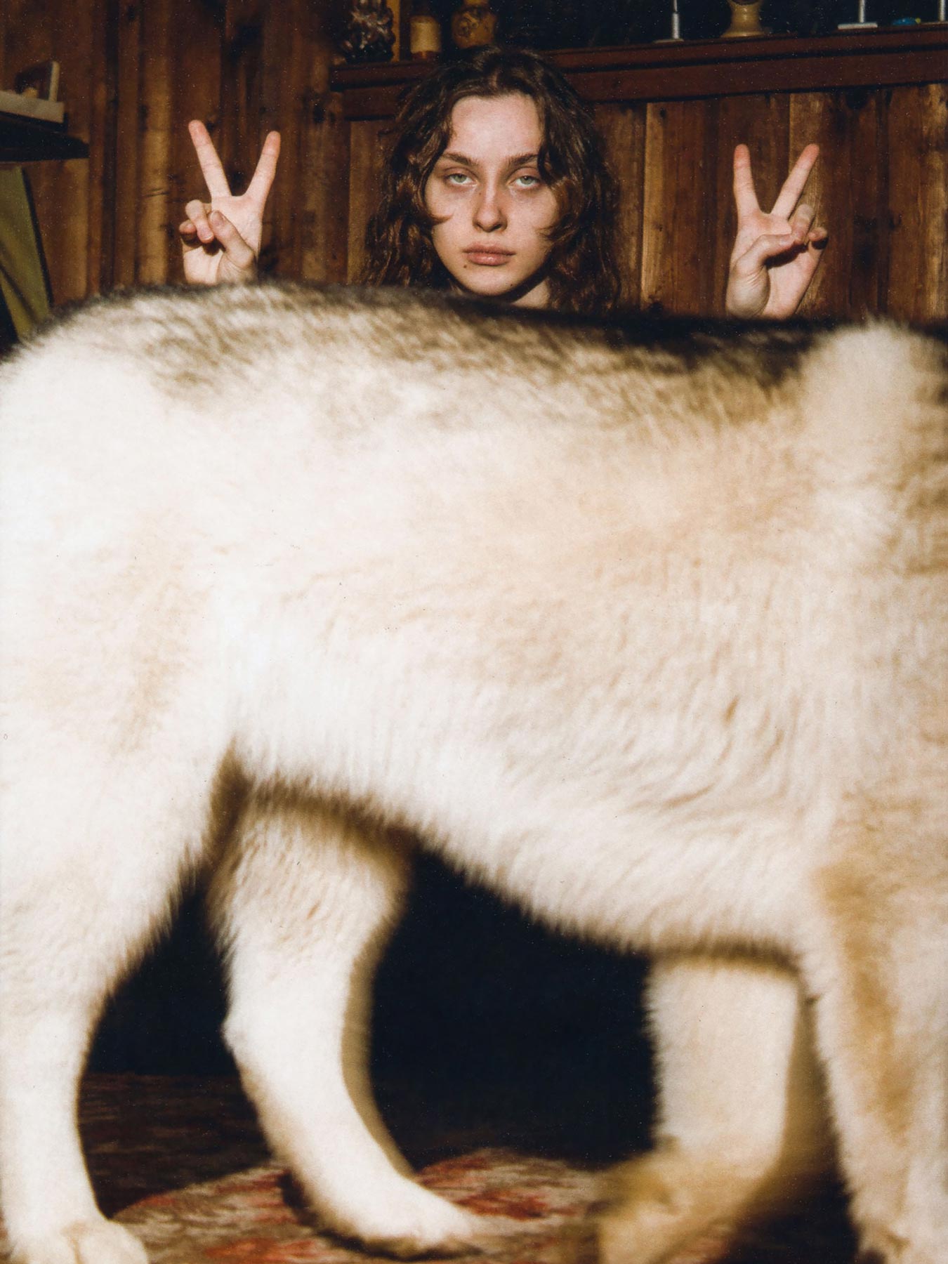 <p>Dima Komarov is known worldwide for his playful and earnest portraiture of Russia’s Gen Z. In his world, there are no barriers between the photographer and the subject — and there is always a bit of shared experience or, as in this case, the happy accident of a four-legged friend walking into the frame.</p>