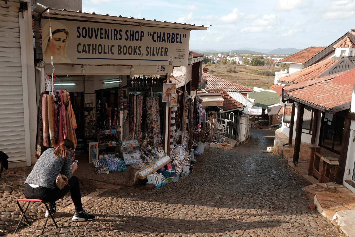 A line of souvenir shops near Apparition Hill.