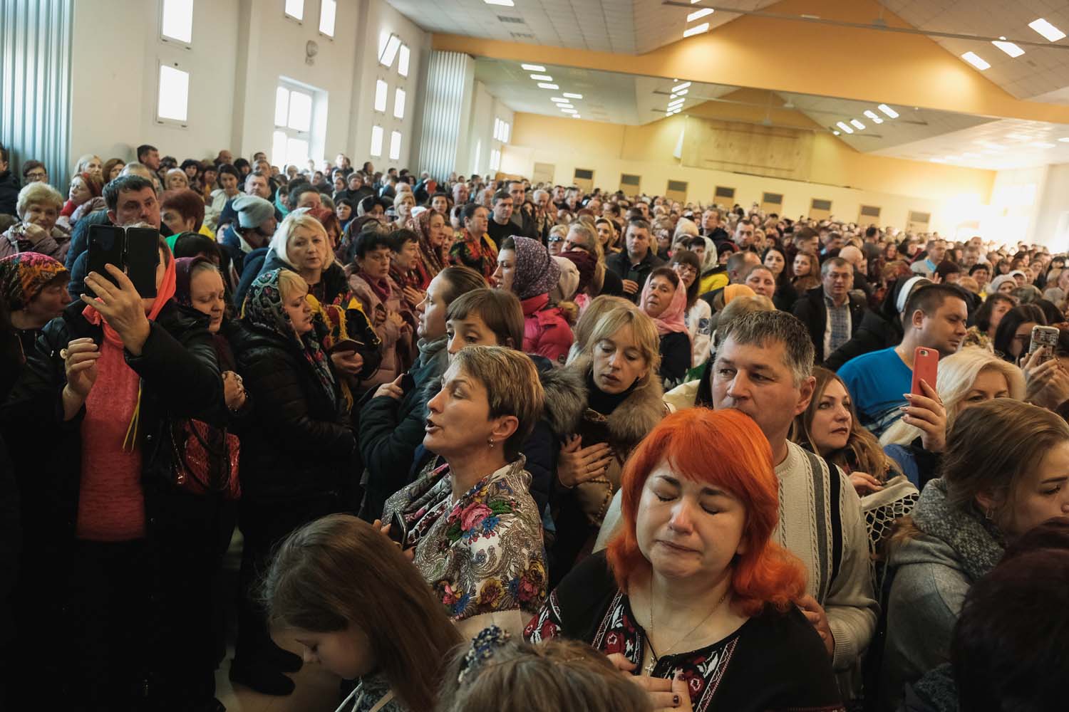 A group of Ukrainians gather for Christmas Day mass at a chapel near Saint James’ Church.
