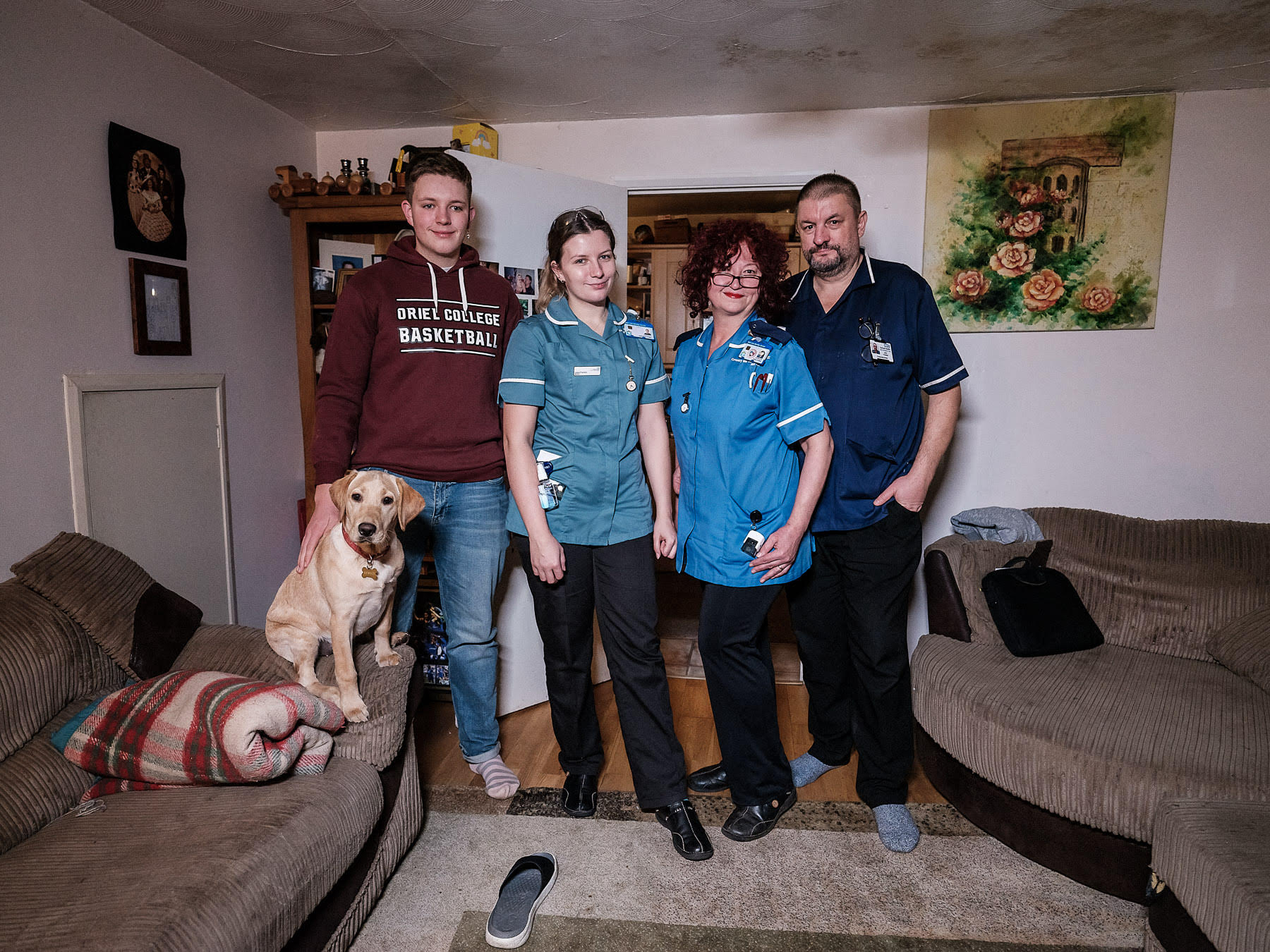 The nurses Camelia and Cătălin Frandeș, and their children, Andrei, a medicine student, and Ioana, a midwife trainee, in their family home inRugby, UK.