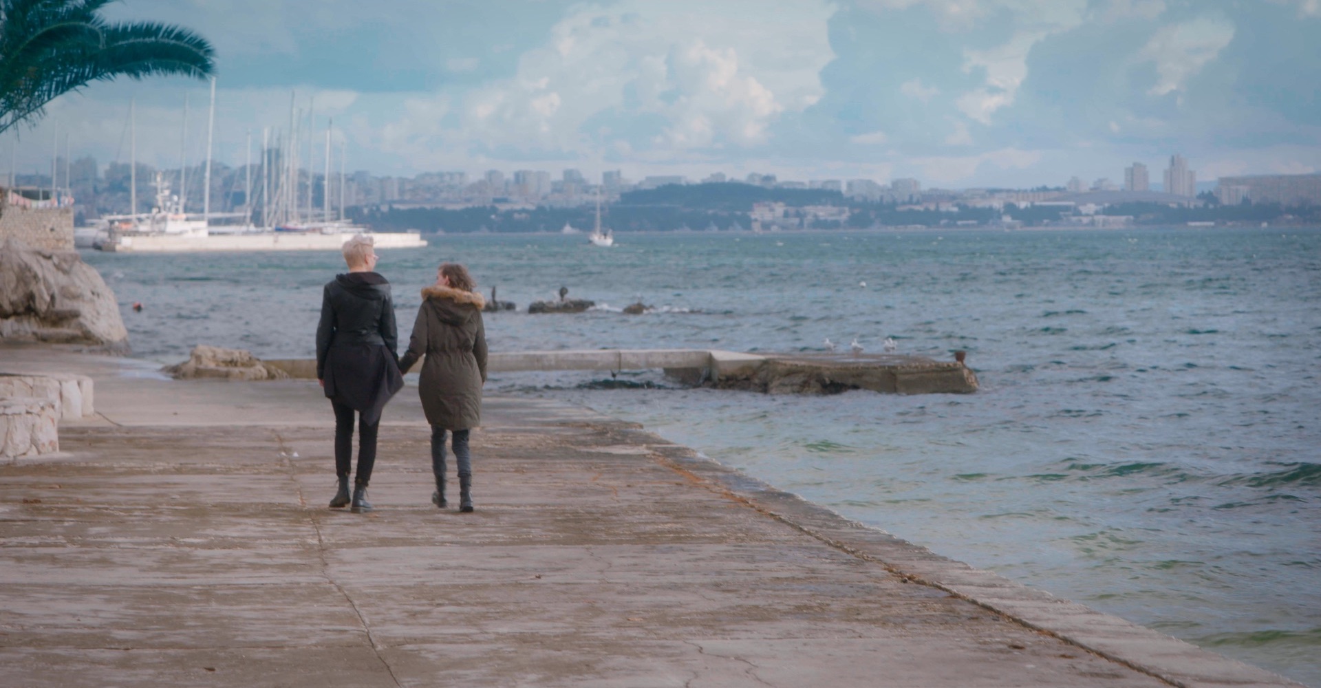 Orlović and Matea walk along the seafront in Split