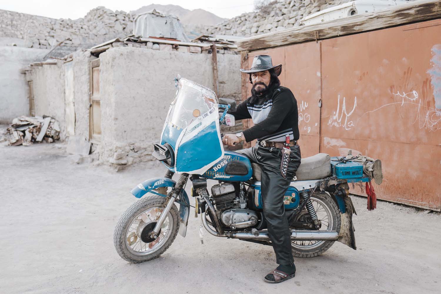 In the workshop next to Bobur’s house is his blue-painted motorbike, emblazoned with the words “Lone Wolf” and “Big Boss”