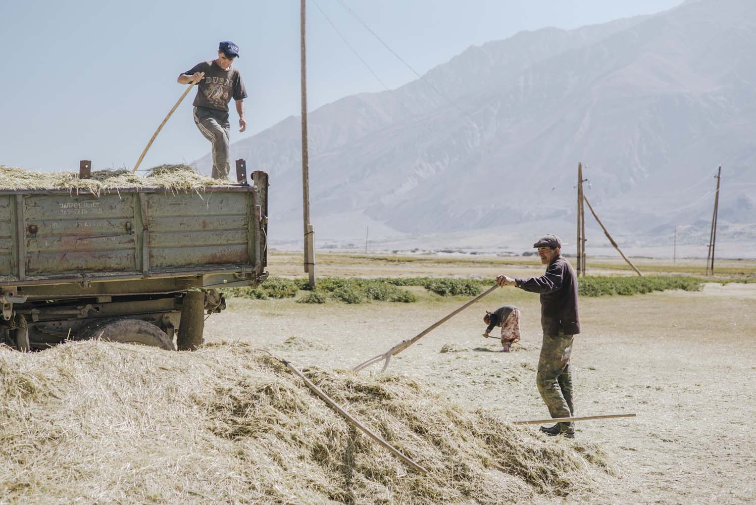 Farmers working with rudimentary techniques in the Pamir Mountains