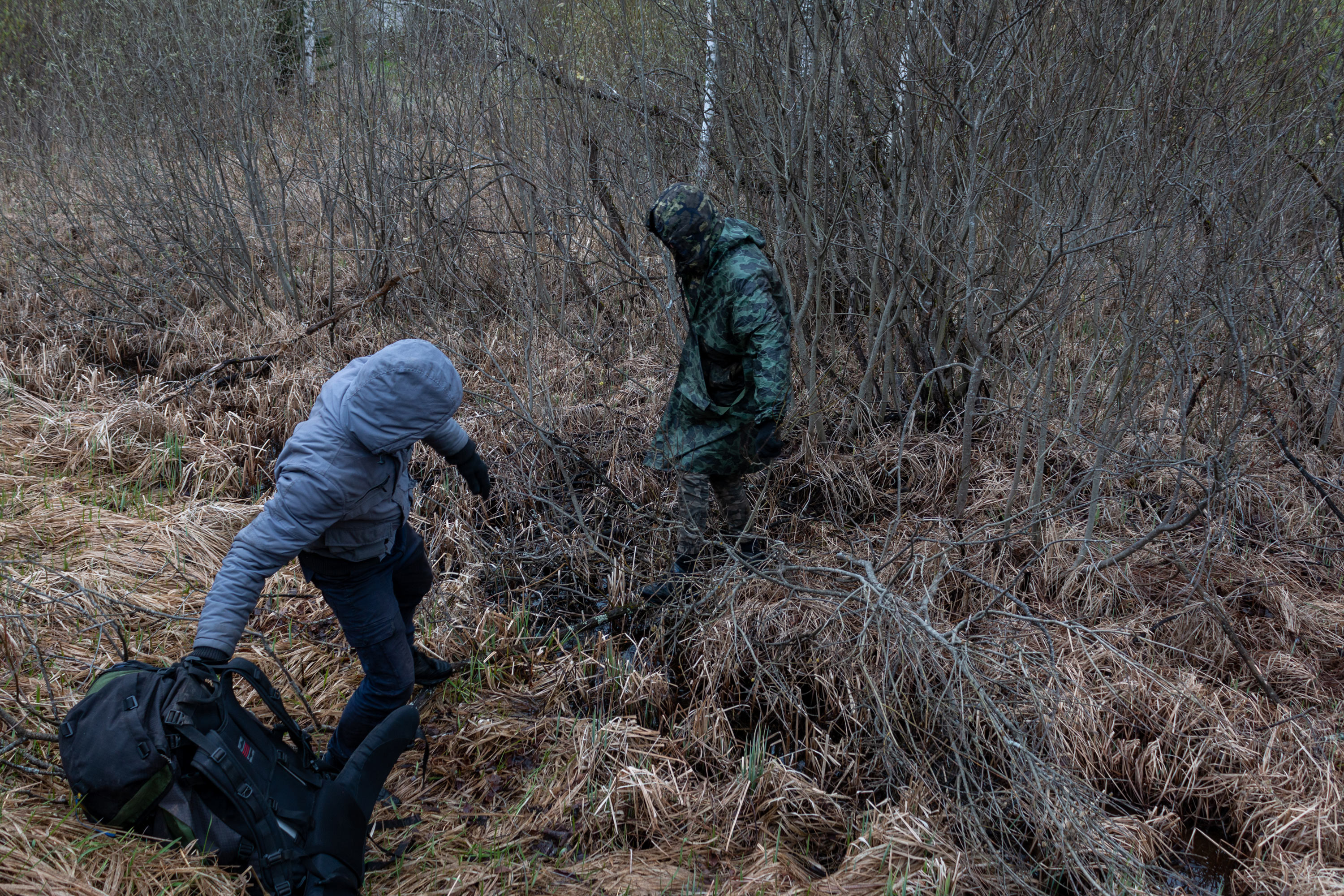 Vova helping Artem to climb out of the swamp. The guys often pick unusual routes to avoid staff and security on the way to the rail yard.