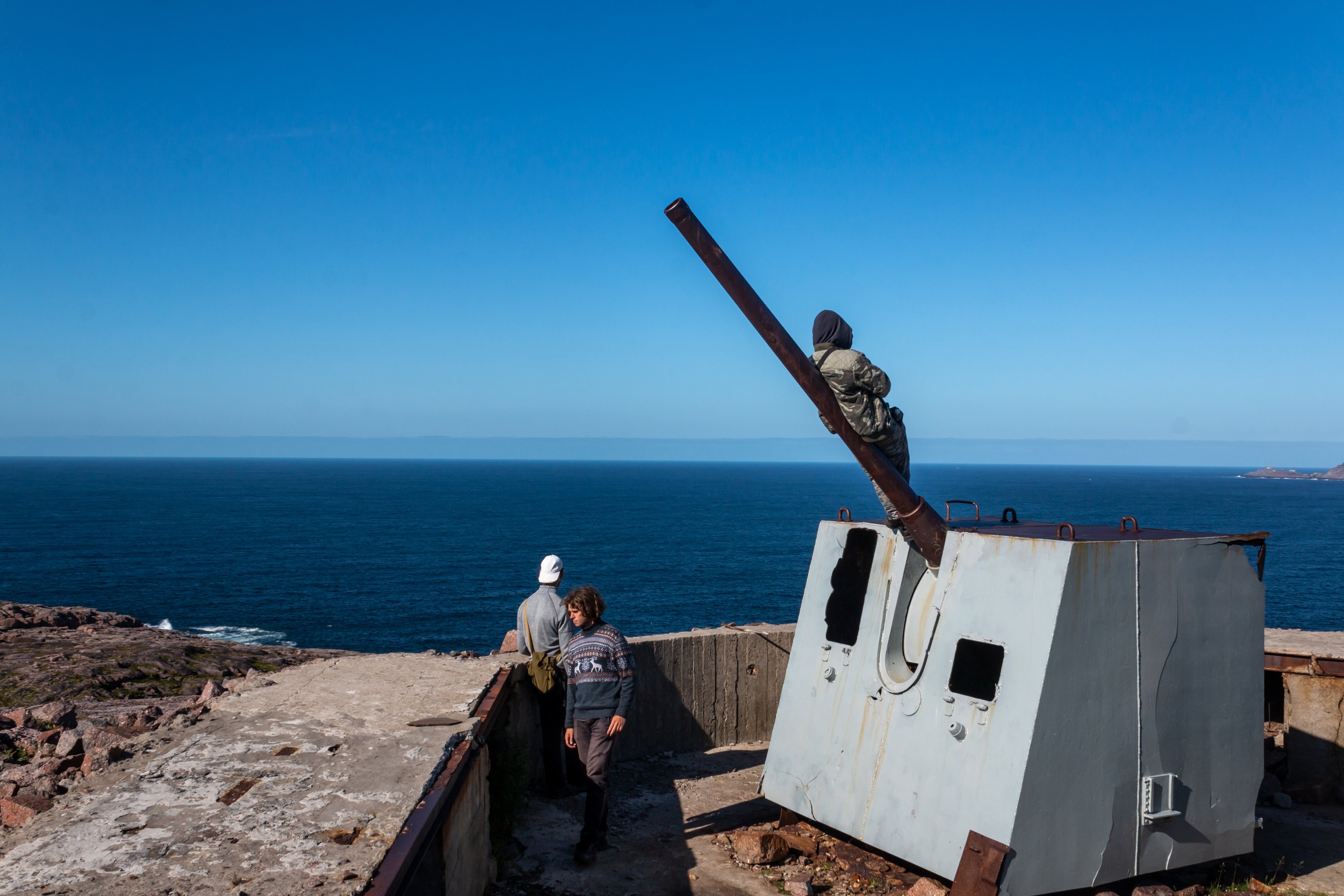 Roma and Danya staring at the Barents Sea from the WWII artillery positions.