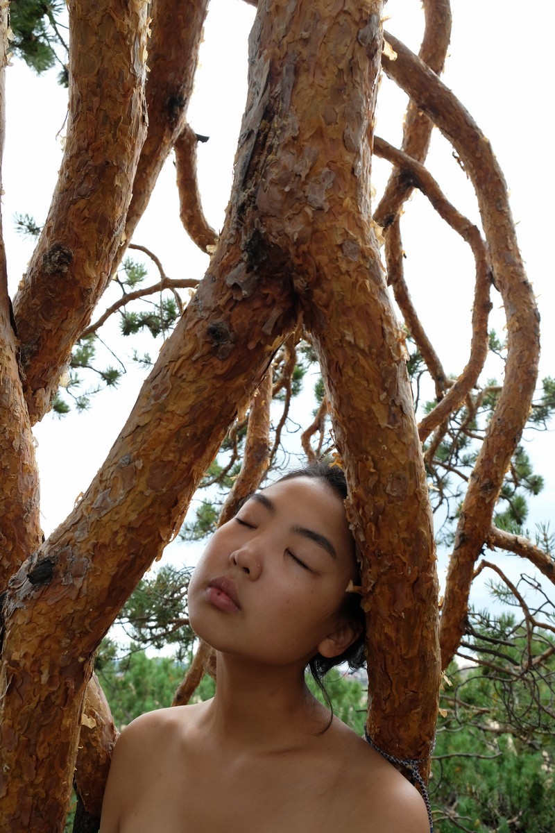 <p>Based in St Petersburg, photographer Ayuna Shagdurova hails from Buryatia in eastern Siberia. Spirituality, tradition, and the faces of her own indigenous Buryat community are all key topics in Shagdurova’s practice. This self-portrait was taken in 2018 on Lake Baikal’s Olkhon Island, during a walk with her family. </p>