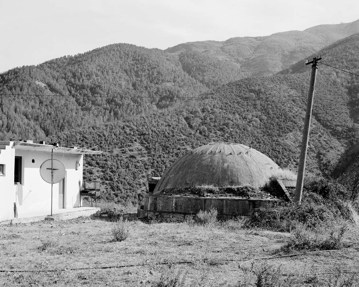 PZ bunker next to a house in Mirakë