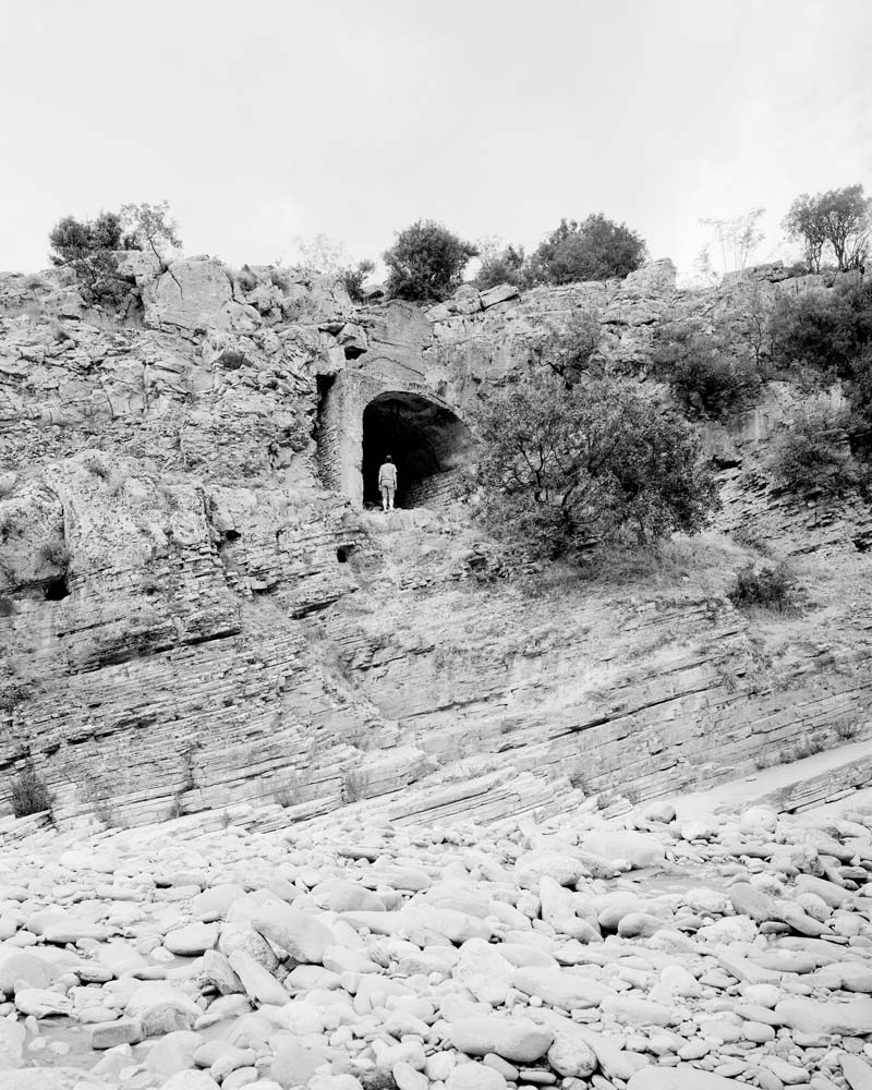 A concrete tunnel dug into the rock, close to the thermal baths of Bënjë.