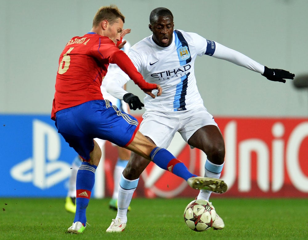 Alexei Berezutsky of PFC CSKA Moscow in action against Yaya Touré of Manchester City FC at the Arena Khimki Stadium in Russia. Photograph: Epsilon/Getty
