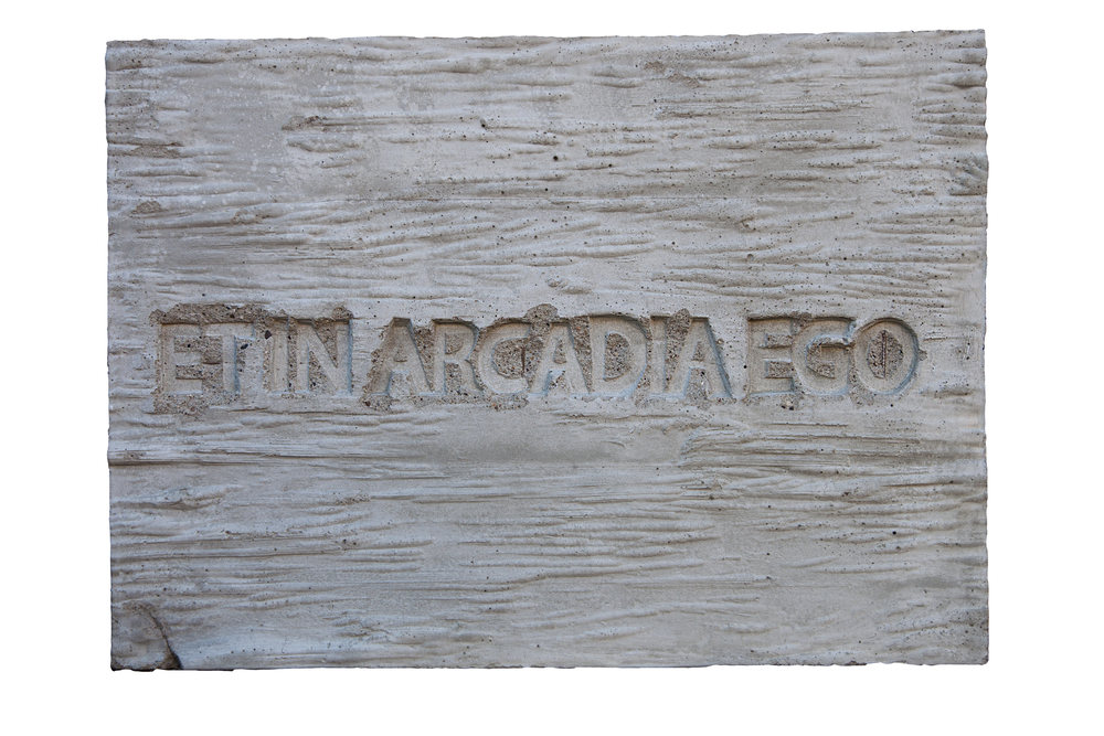 Et in Arcadia Ego (“And I too once lived in Arcadia”), 2017. This plaque with a Latin inscription usually interpreted as a memento mori was originally placed by the artist on a city street. Arcadia refers to a utopian pastoral land